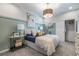 Cozy bedroom with natural light, complemented by stylish furnishings and easy access to a built-in closet at 18039 Cherished Loop, Bradenton, FL 34211