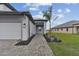 Front entry with walkway, landscaping, and two-car garage at 18039 Cherished Loop, Bradenton, FL 34211