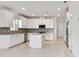 Modern kitchen with white cabinets and stainless steel appliances at 18039 Cherished Loop, Bradenton, FL 34211