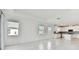 Bright and airy living room with tile floors and sliding glass doors leading to a view at 18039 Cherished Loop, Bradenton, FL 34211