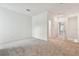 Loft bedroom with carpeted floor and access to hallway at 282 Via Anina Dr, Sarasota, FL 34243