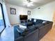 Open living space with sectional sofa and access to balcony at 7121 River Hammock Dr # 107, Bradenton, FL 34212