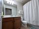 Clean bathroom with single vanity, toilet, and shower/tub combo at 7121 River Hammock Dr # 107, Bradenton, FL 34212