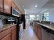 Modern kitchen with granite countertops and stainless steel appliances at 7121 River Hammock Dr # 107, Bradenton, FL 34212