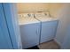 Laundry room with a washer and dryer at 7121 River Hammock Dr # 107, Bradenton, FL 34212
