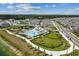 Aerial view featuring community pool, tennis, playground, and dog park at 7428 Cabin Ln, Sarasota, FL 34240