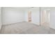 Bedroom featuring neutral carpeting, and doorways providing seamless flow between spaces at 7428 Cabin Ln, Sarasota, FL 34240