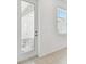 Entryway with door and view of an outdoor patio area at 7428 Cabin Ln, Sarasota, FL 34240