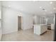 Open concept living room and kitchen featuring tile flooring and recessed lighting at 7428 Cabin Ln, Sarasota, FL 34240