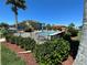 Community pool with lounge chairs and shaded area at 7121 River Hammock Dr # 107, Bradenton, FL 34212