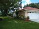 Home's exterior with a two-car garage and landscaping at 1608 Bob O Link Dr, Venice, FL 34293