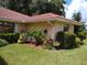 Exterior view showcasing landscaping and a tiled roof at 1608 Bob O Link Dr, Venice, FL 34293