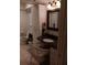Bathroom with granite vanity and wicker chair at 1608 Bob O Link Dr, Venice, FL 34293