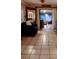 Living room with tiled floor and view to sunroom at 1608 Bob O Link Dr, Venice, FL 34293