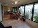 Sunroom features a dining area and view of the backyard at 1608 Bob O Link Dr, Venice, FL 34293