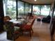 Bright sunroom with seating area and glass windows at 1608 Bob O Link Dr, Venice, FL 34293