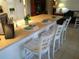Kitchen with breakfast bar and white countertops at 1608 Bob O Link Dr, Venice, FL 34293