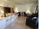 Open concept kitchen with a breakfast bar and white cabinetry at 1608 Bob O Link Dr, Venice, FL 34293