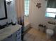 Bathroom with vanity, bathtub, and seashell decor at 1608 Bob O Link Dr, Venice, FL 34293