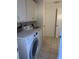Bright laundry room featuring a washer and dryer at 1608 Bob O Link Dr, Venice, FL 34293