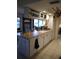 Bright kitchen with an island, ample cabinetry, and a view to the backyard at 1608 Bob O Link Dr, Venice, FL 34293