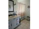 Bathroom with vanity, bathtub, and seashell decor at 1608 Bob O Link Dr, Venice, FL 34293