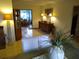 Dining room with a view of a sunroom and a wooden buffet at 1608 Bob O Link Dr, Venice, FL 34293