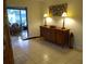 Dining area with a glass-top table, and access to a sunroom at 1608 Bob O Link Dr, Venice, FL 34293