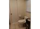 Simple bathroom with toilet and tiled floors at 1608 Bob O Link Dr, Venice, FL 34293