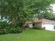 Single-Gathering home with mature trees and manicured lawn at 1608 Bob O Link Dr, Venice, FL 34293