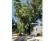Gray house nestled amongst tropical foliage at 1480 17Th St, Sarasota, FL 34234