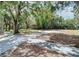 Dark gray house with large windows and lush yard at 1480 17Th St, Sarasota, FL 34234