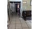 Living room with tiled floor and view to bedroom at 2415 E 21St Ave, Tampa, FL 33605