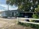House exterior with carport and a white picket fence at 2415 E 21St Ave, Tampa, FL 33605