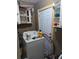 A functional laundry room with washer, dryer, and storage at 2415 E 21St Ave, Tampa, FL 33605