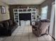 Living room with a TV, couch and recliner at 2415 E 21St Ave, Tampa, FL 33605