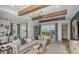 Bright and airy living room with large windows and comfortable seating at 289 Vistera Blvd, Nokomis, FL 34275