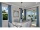 Elegant dining room featuring a spacious table and access to the outdoors at 289 Vistera Blvd, Nokomis, FL 34275
