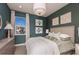 Cozy bedroom with a neutral color palette and decorative wall art at 289 Vistera Blvd, Nokomis, FL 34275