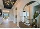 Bright and airy entryway with wood-look floors, a large mirror and modern decor at 289 Vistera Blvd, Nokomis, FL 34275