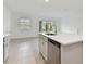 Modern kitchen with island, stainless steel appliances, and open layout at 5439 Tripoli Dr, Palmetto, FL 34221