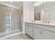 Main bathroom with double vanity, shower, and tile floors at 5439 Tripoli Dr, Palmetto, FL 34221