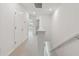 Upstairs hallway with carpet, leading to bedrooms and other rooms at 5439 Tripoli Dr, Palmetto, FL 34221