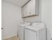 Laundry room with washer, dryer, and overhead cabinets at 5439 Tripoli Dr, Palmetto, FL 34221