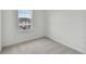 Charming bedroom featuring a window with a view and neutral carpeting at 5439 Tripoli Dr, Palmetto, FL 34221