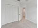 Bright bedroom with double doors leading to a large closet and bathroom at 5439 Tripoli Dr, Palmetto, FL 34221