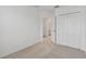 Well-lit bedroom with an attached bathroom and double doors at 5439 Tripoli Dr, Palmetto, FL 34221