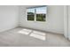 Bedroom with large window and carpet flooring at 5439 Tripoli Dr, Palmetto, FL 34221