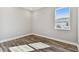 Bright bedroom with wood-look floors and a window offering natural light at 17353 Savory Mist Cir, Bradenton, FL 34211