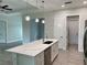 Open concept kitchen with island and stainless steel appliances at 23466 Garrett Ave, Port Charlotte, FL 33954